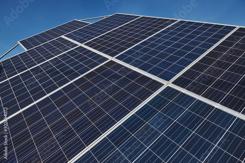 Close up view of polished surface of solar batteries at sunny daytime