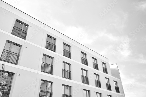 Contemporary apartment building. Generic residential architecture. Black and white.