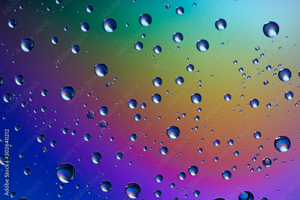 water drops on glass colorful background