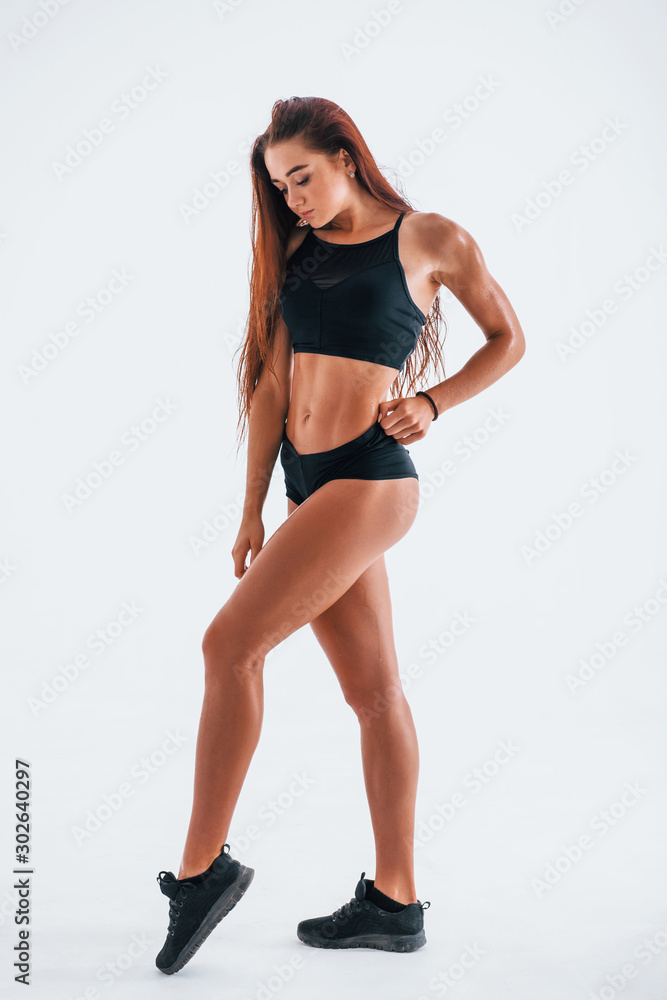Young woman with slim body type isolated against white background