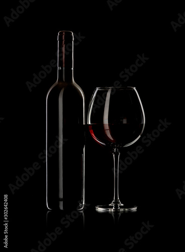 bottle and wine glass with red wine