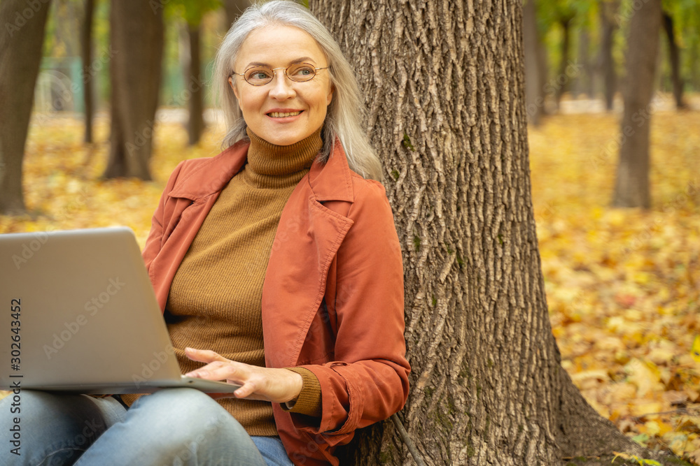 Happy woman working in a city park Happy woman working in a city park