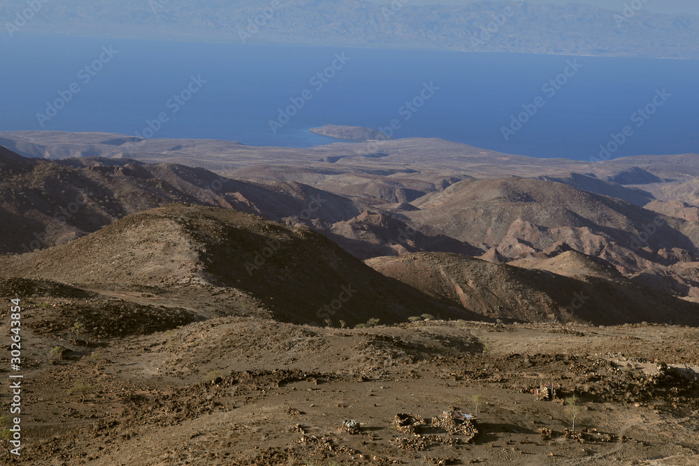 Mountains of Gulf of Tadjourah, Djibouti; a nomadic settlement in the foreground