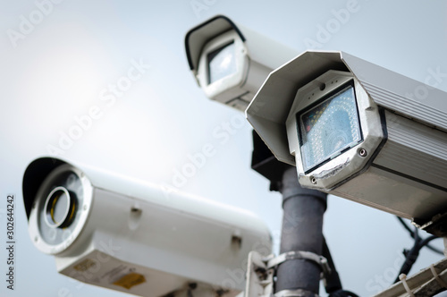 Close Up of a Security CCTV Cameras on a lamp post in the park