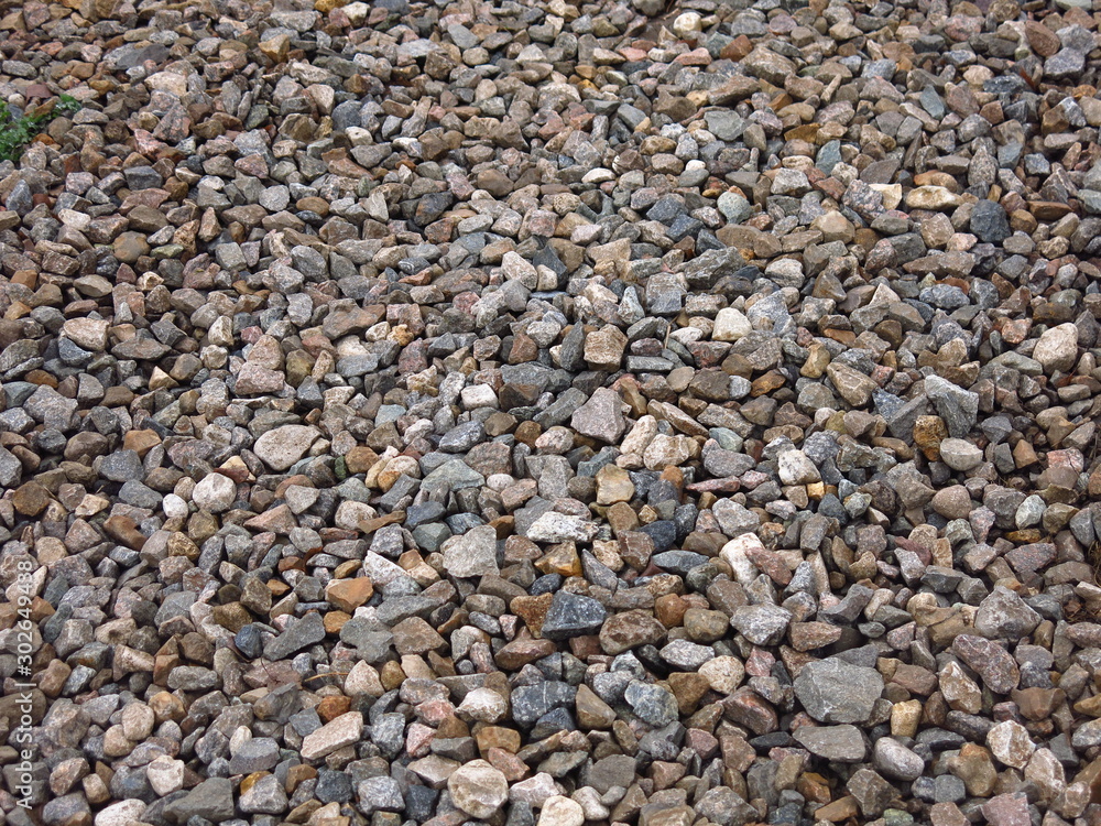 gray gravel on a road of stones gray gravel on a road of stones