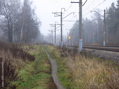 the path along the railway damp foggy autumn