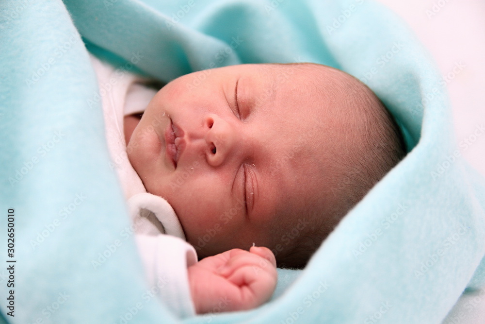baby sleeping wrapped up in blanket just been cared for after having a good sleep in bed stock photograph stock photo baby sleeping wrapped up in blanket just been cared for after having a good sleep in bed stock photograph stock photo