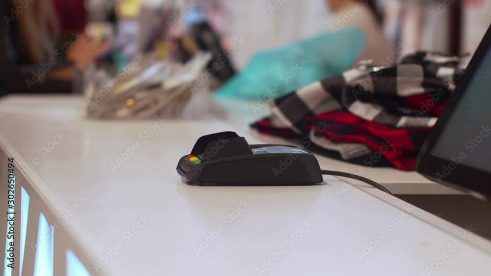 Man pays for purchase with the help of phone Man pays for purchase with the help of phone
