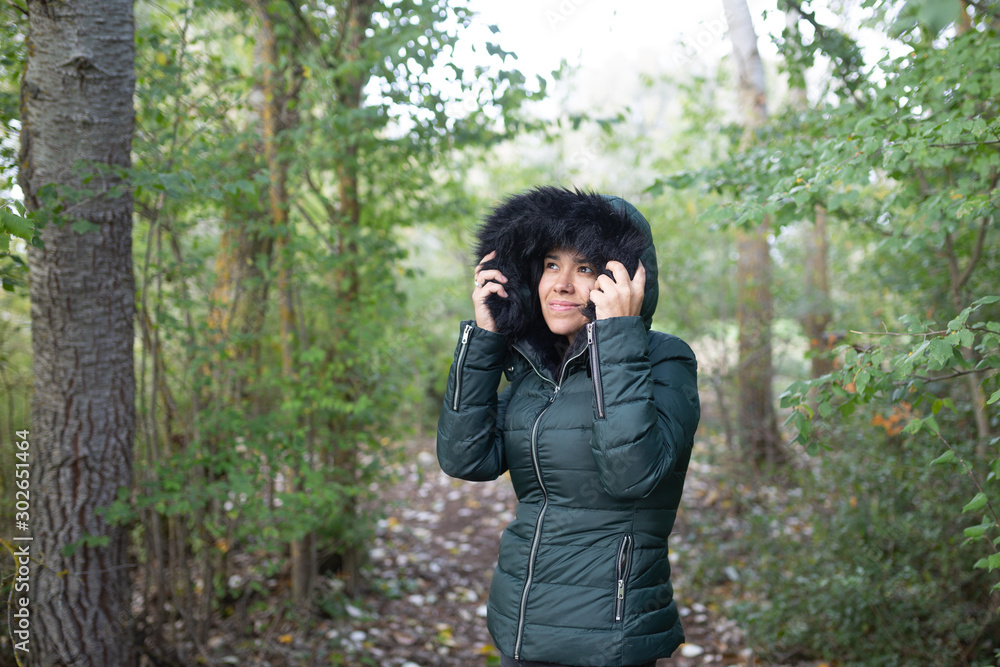 young woman protects herself from the cold young woman protects herself from the cold