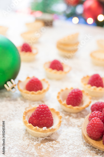 red raspberry cakes with christmas ornaments