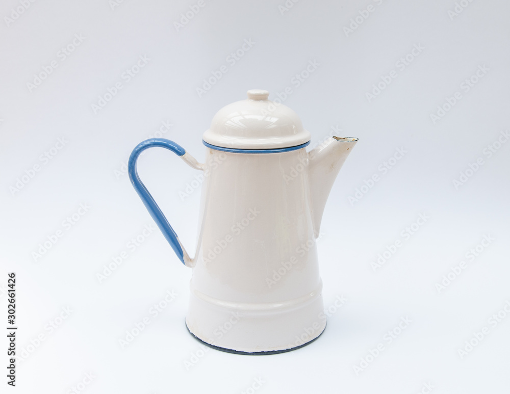 Traditional enamle kettle, jug white and blue colors - metal can, pouring Traditional enamle kettle, jug white and blue colors - metal can, pouring