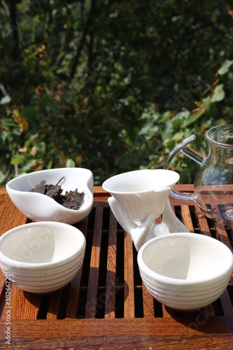 Chinese tea ceremony using tea utensils in nature.