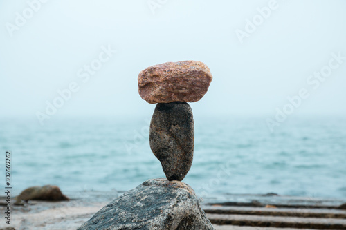 Canvas Print rocks balance on the seaside promenade, gravity balance of stones