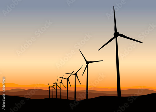 Wind Power Turbine on Orange Sunset