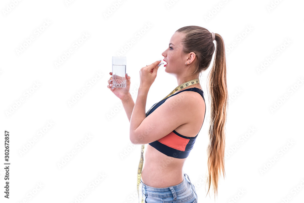 Woman taking pill isolated on white. Dieting concept Woman taking pill isolated on white. Dieting concept