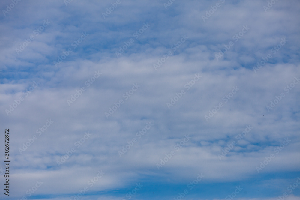 Blue sky background with clouds.