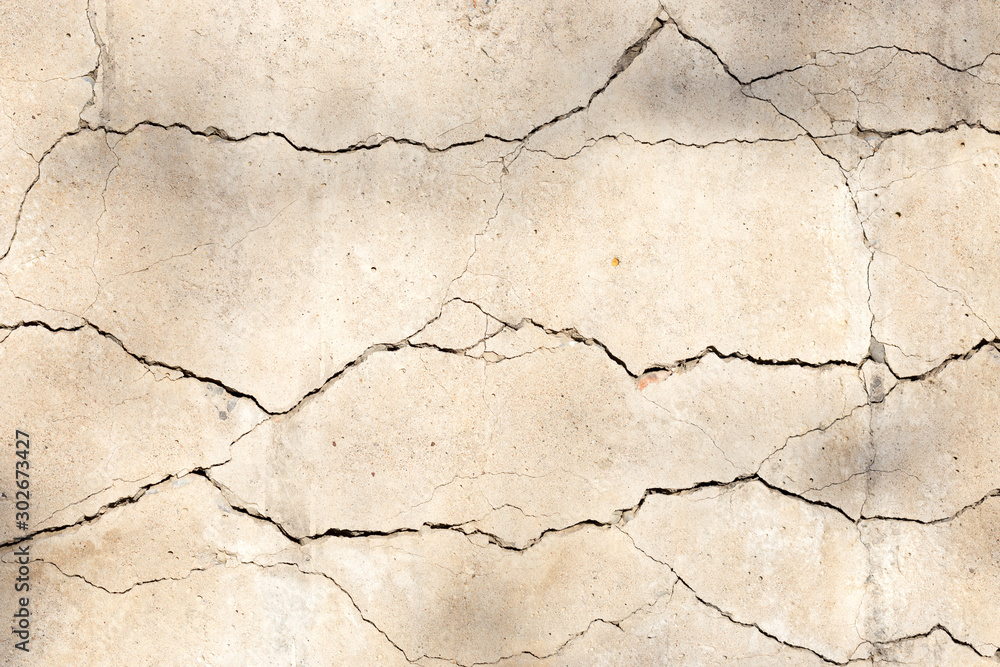 cracked concrete cement wall in industrial building, great for your design and texture background