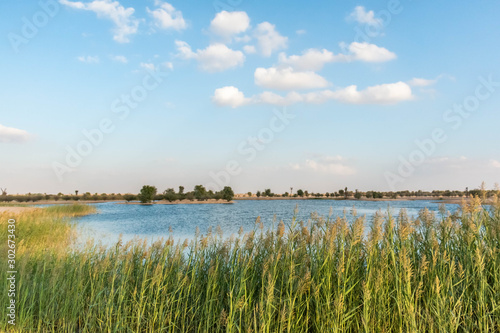 Cloudy sky over lake  blue sky.