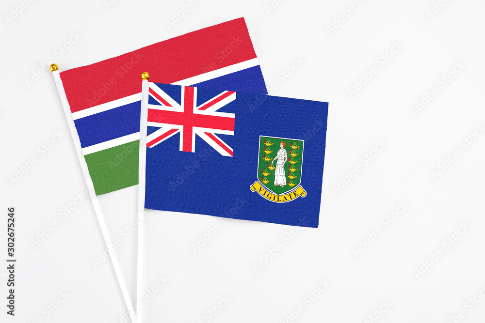 Fototapeta premium British Virgin Islands and Georgia stick flags on white background. High quality fabric, miniature national flag. Peaceful global concept.White floor for copy space.