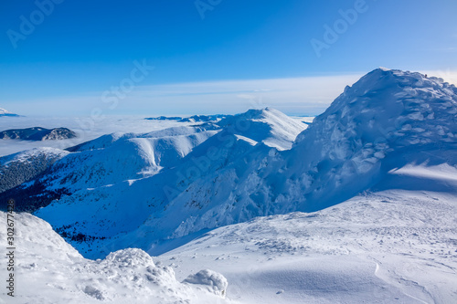 Blue Sky over Snowy Peaks © goodman_ekim