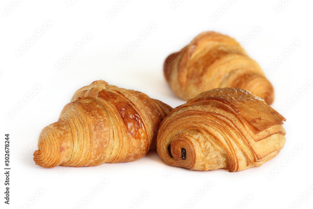 Viennoiserie traditional french pastry - pain au chocolat and croissants isolated on white background Viennoiserie traditional french pastry - pain au chocolat and croissants isolated on white background