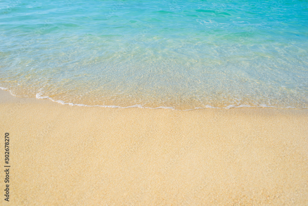Ocean waves on the beach and blue water in Phuket, Thailand during the high season. Holidays and travel Ocean waves on the beach and blue water in Phuket, Thailand during the high season. Holidays and travel