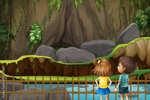 Boy and girl looking at the empty cage