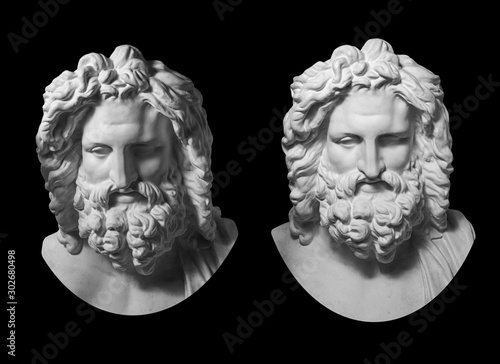 Photos Two gypsum copy of antique statue Zeus head isolated on black background