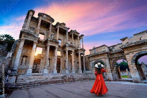 Woman standing in Celsus Library at Ephesus ancient city in Izmir, Turkey. photo