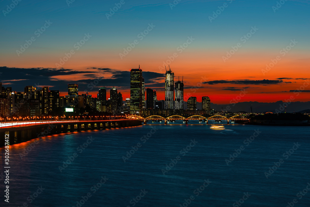 The skyline of the city at the Han River in the heart of Seoul at night, South Korea
