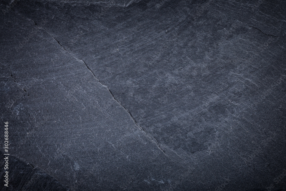 Naklejka premium Dark grey and black slate background or texture