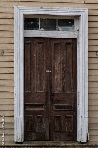 An old, abandoned, vintage double front door. Shot in portrait, vertical orientation. Gordonsville, Virginia. photo
