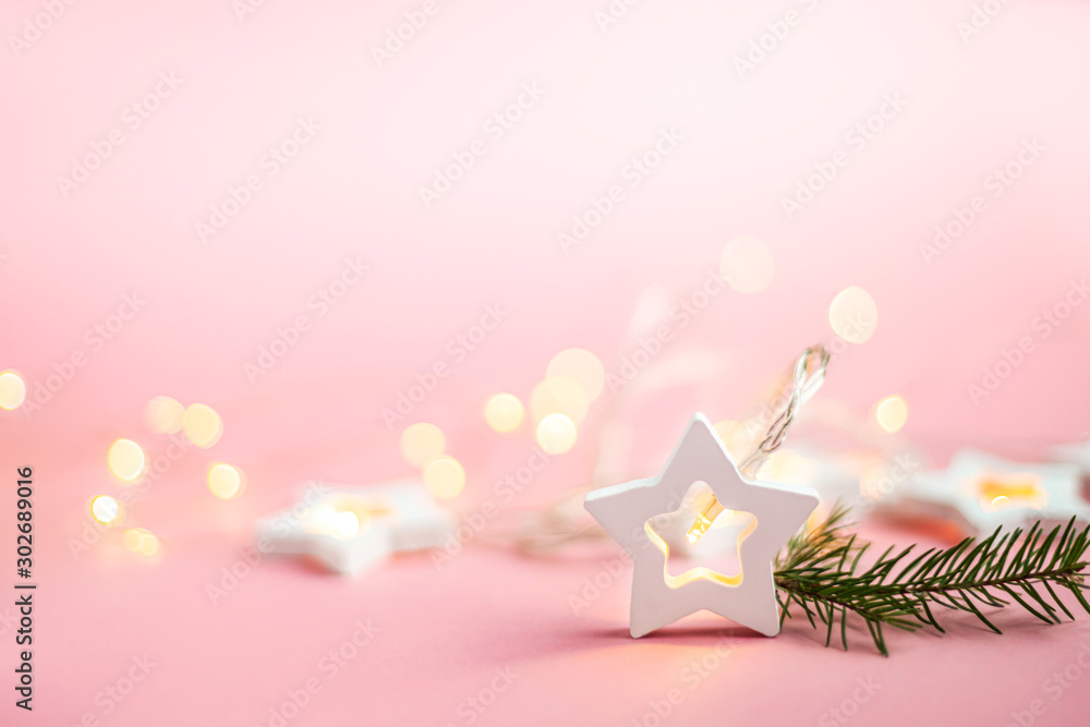 Merry Christmas and Happy Holidays  banner and greeting card. New Year. Wooden stars on a yellow christmas light bokeh background with copy space.Winter holiday theme.Wallpaper.
