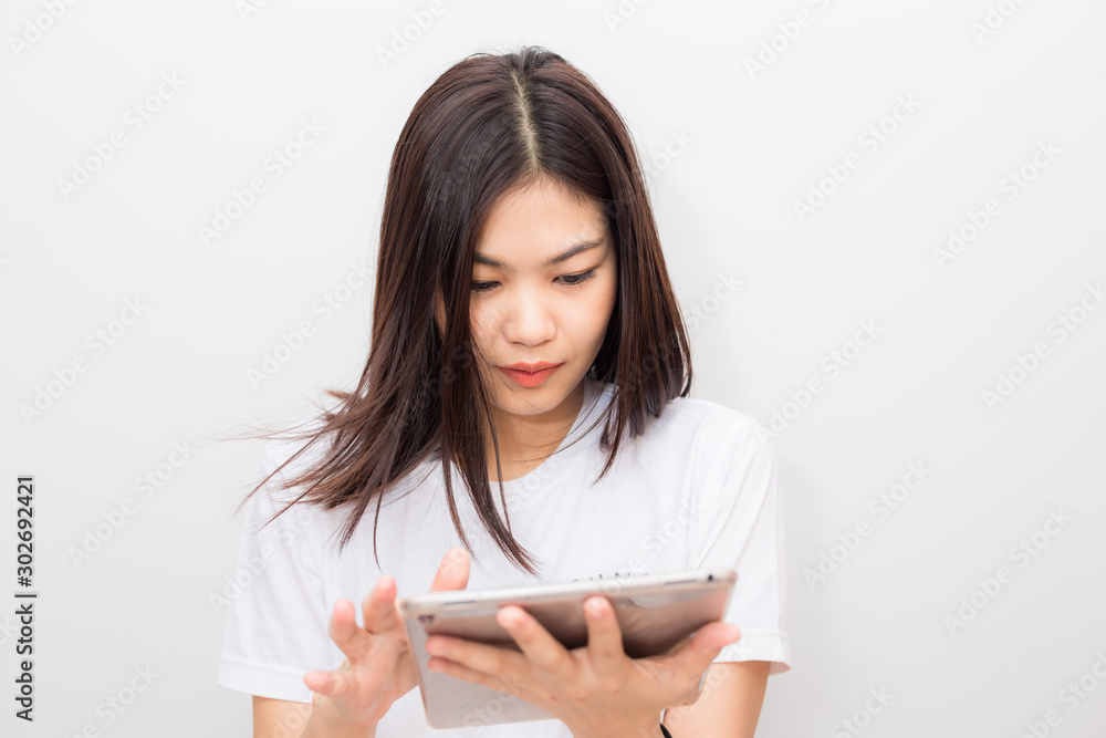 Business smiling women with tablet computer on white background Business smiling women with tablet computer on white background