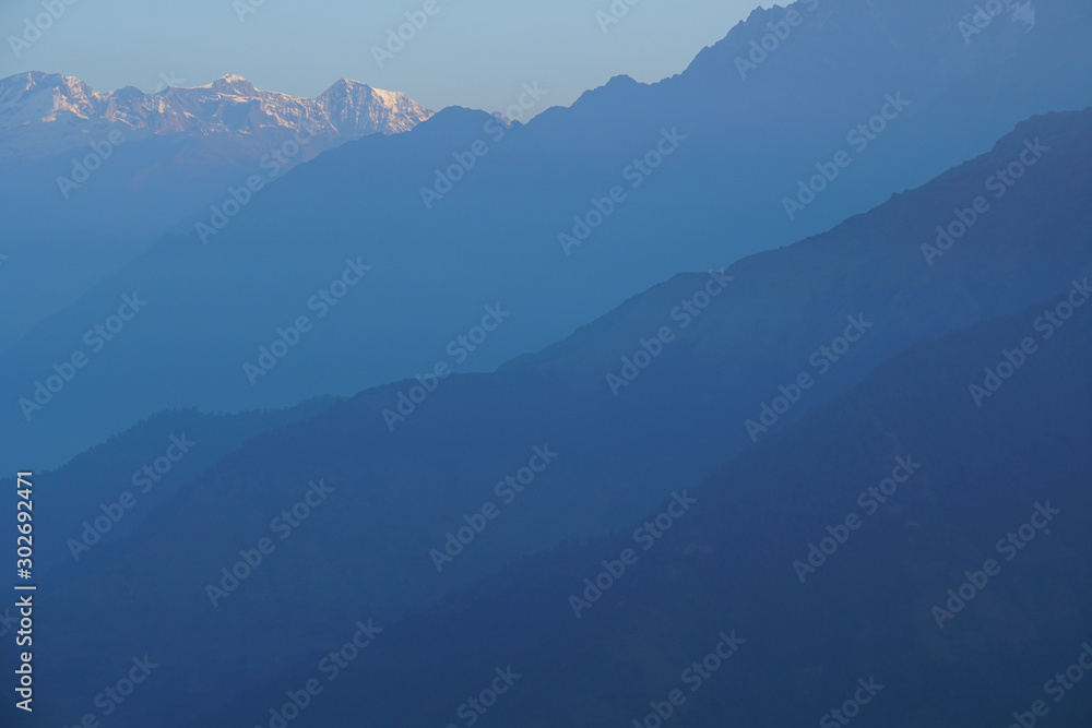 Himalaya rang mountain view of Mt. Dhaulagiri massif and Annapurna mountain at seen from Poon Hill, Nepal - trekking route from Ghorepani - Nature background Texture