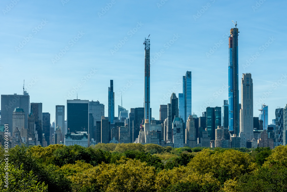 New York skyscrapers over Central Park trees New York skyscrapers over Central Park trees