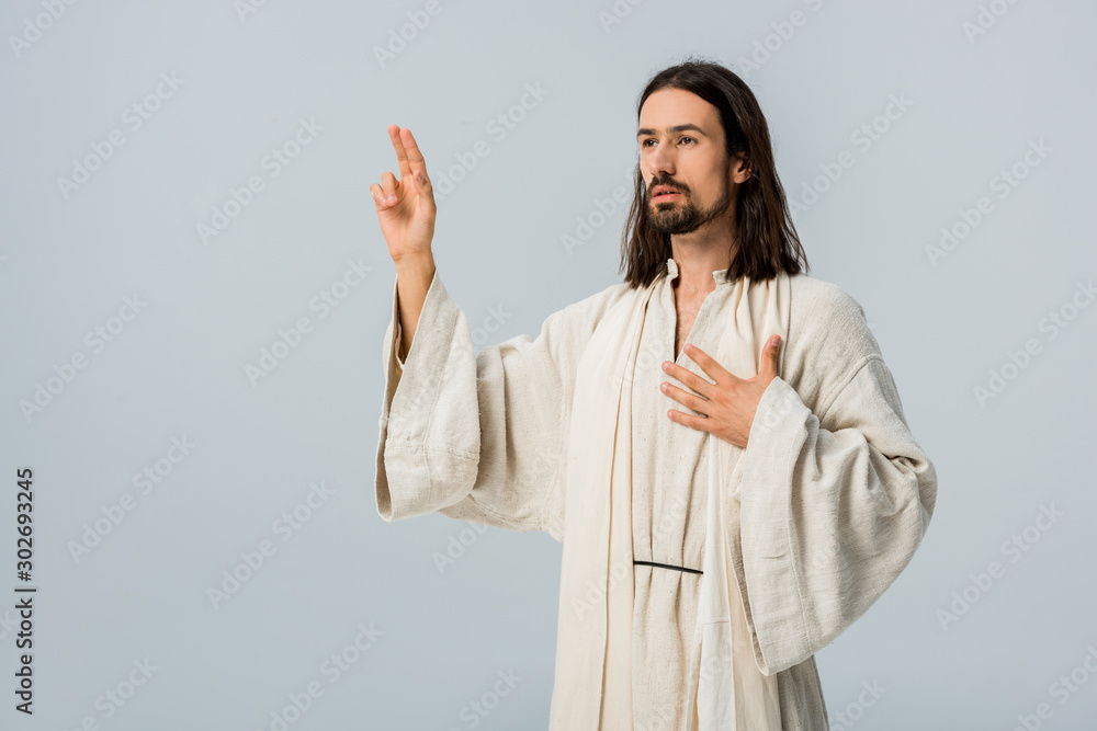 bearded man praying while gesturing isolated on grey bearded man praying while gesturing isolated on grey