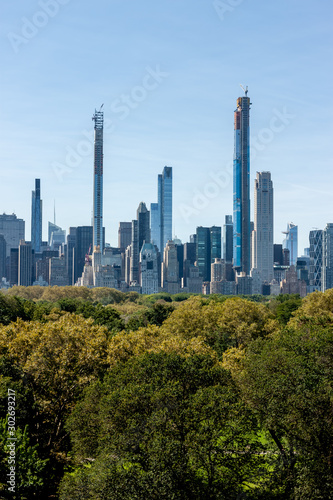 New York skyscrapers over Central Park trees © chechotkin