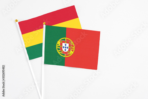 Free Download Portugal and Ghana stick flags on white background. High quality fabric, miniature national flag. Peaceful global concept.White floor for copy space. - GFXLoad