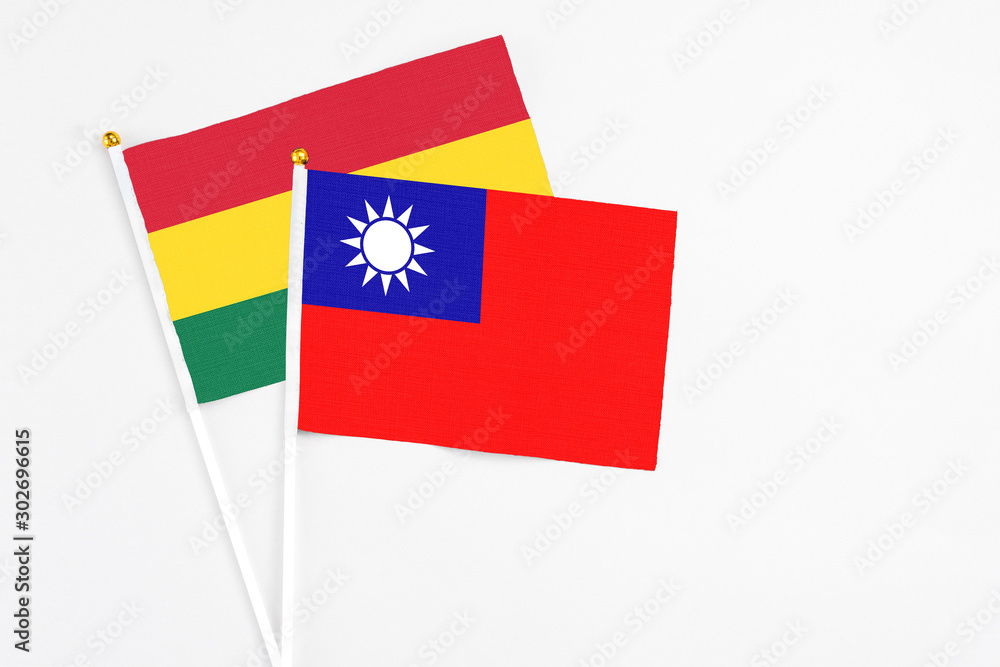 Taiwan and Ghana stick flags on white background. High quality fabric, miniature national flag. Peaceful global concept.White floor for copy space. Taiwan and Ghana stick flags on white background. High quality fabric, miniature national flag. Peaceful global concept.White floor for copy space.