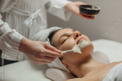 Cosmeotologist Applying a Facial Mask