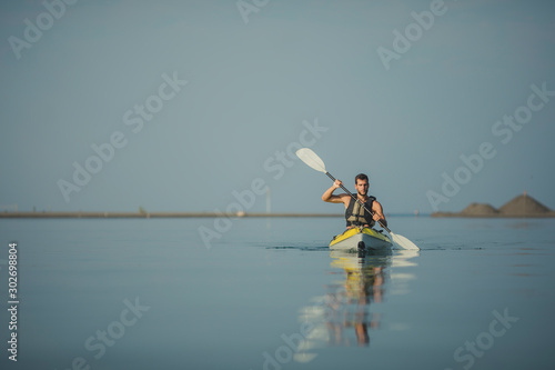 Handsome Young Man Kayaking