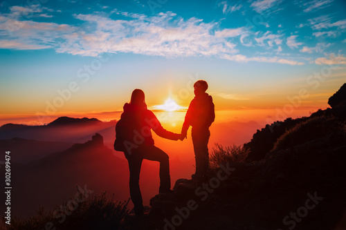 mother and son travel in mountains at sunset, family hiking in nature © nadezhda1906