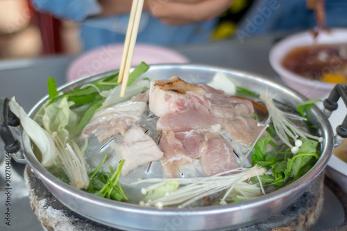 Thai Barbecue Style (Pork Pan).pork on a hot plate