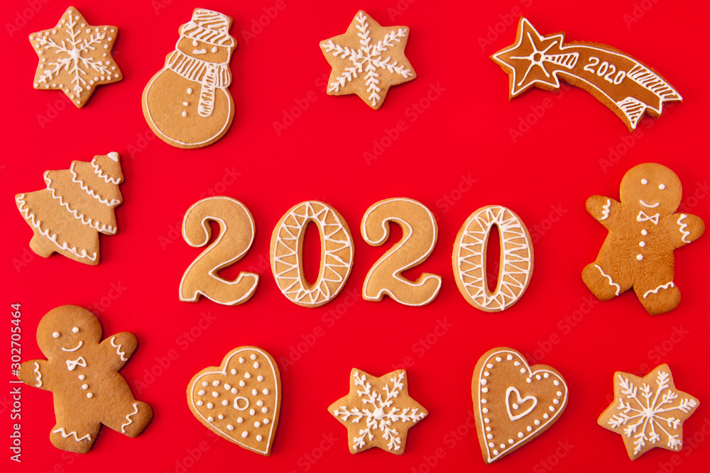 Top above high angle view photo of festive x-mas composition of ginger bread cookies man snowman tree star falling heart letters making 2020 lie isolated over shine color background