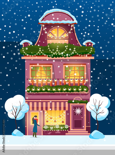 Snowfall in city or town vector. Woman wearing earmuffs and warm clothes standing by home. Building exterior decorated by wreaths and garlands. Wintertime facade of house with wreath flat style
