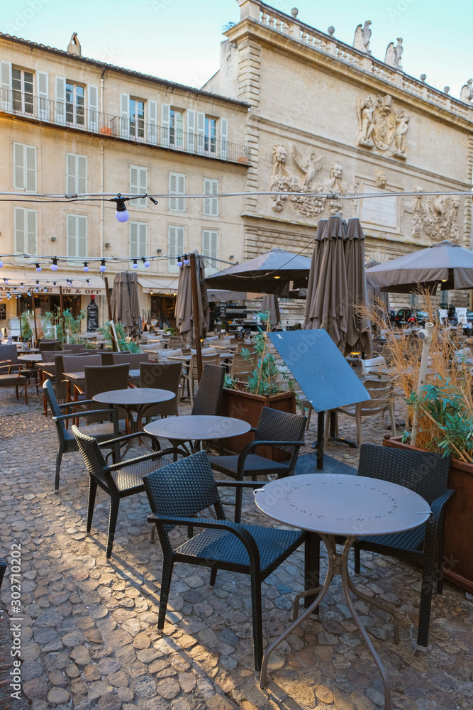 Documentary image. Editorial Illustrative. Avignon. Provence. France. September 16. 2019. Restaurant empty tables on Old Town Square. Provence tourism.