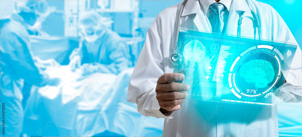 Doctor with virtual reality in operation room in hospital.Surgeon analyzing patient heart testing result and human anatomy on technological digital futuristic virtual interface,digital holographic. Doctor with virtual reality in operation room in hospital.Surgeon analyzing patient heart testing result and human anatomy on technological digital futuristic virtual interface,digital holographic.