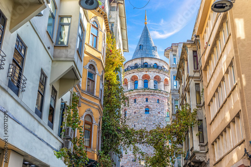 Galata Tower in the wonderful old street of Istanbul, Turkey photo