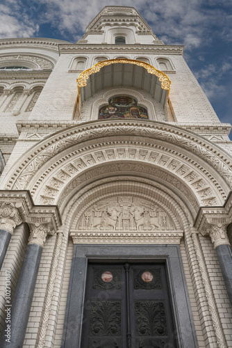 Front view of a fragment of the facade of the Naval Cathedral in Kronstadt, Russia against a blue autumn sky